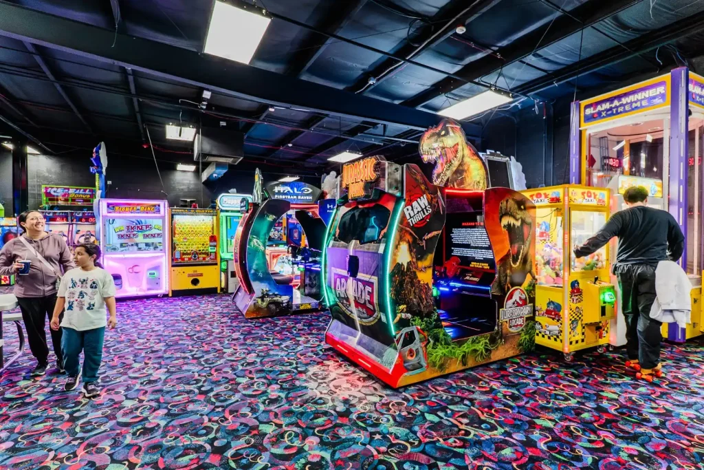 arcade room - several cabinets and games line the walls